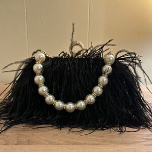 Luxurious Black Feather Clutch with Pearl Handle